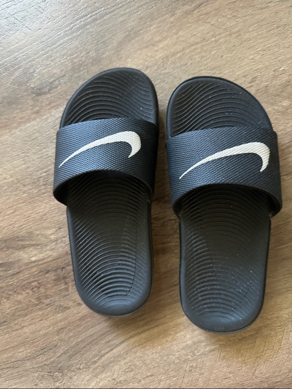 Nike Black Slides with White Swoosh Logo